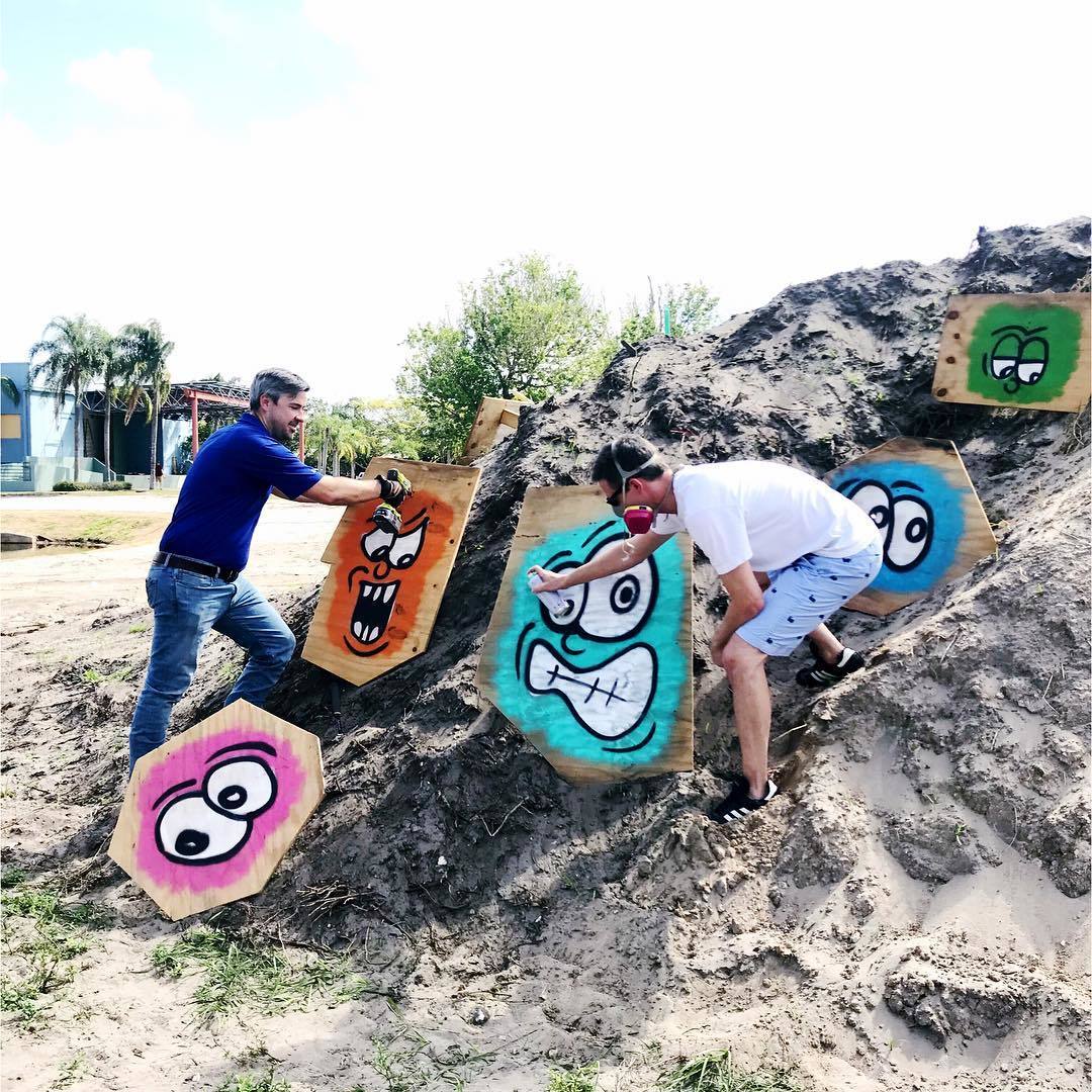 The Alliance for the Arts is excited to announce David Seitz and Steven Fetterhoff as mystery “dirt pile” artists who draped the eyesore with googly-eyes spray painted on plywood. 